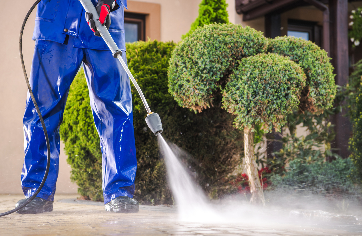 Turbo nozzle rinsing tile driveway during pressure washing